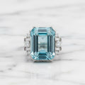 Natural Sky Blue Topaz 12×16 mm Emerald Cut Ring with Moissanite Accents – 925 Sterling Silver