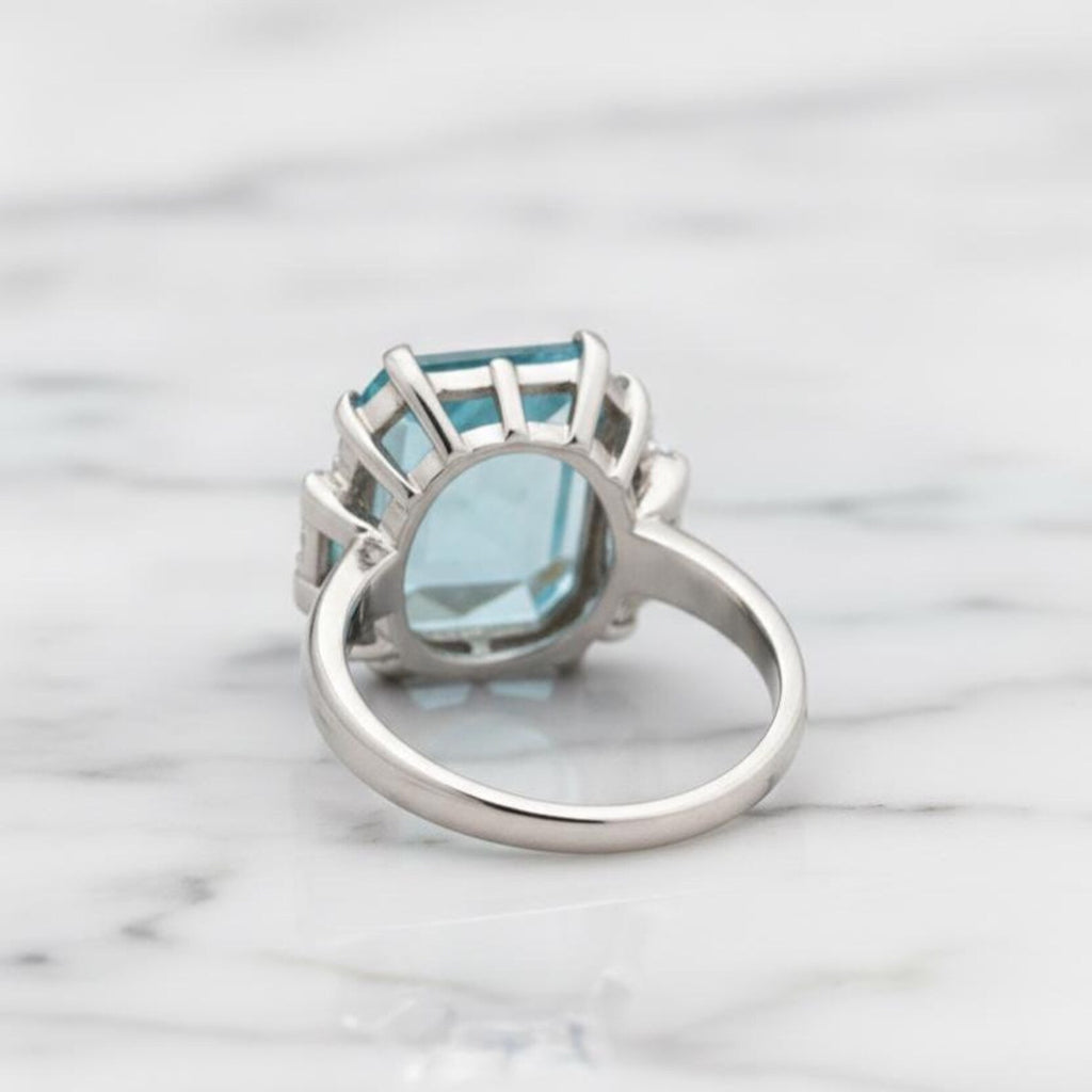 Natural Sky Blue Topaz 12×16 mm Emerald Cut Ring with Moissanite Accents – 925 Sterling Silver
